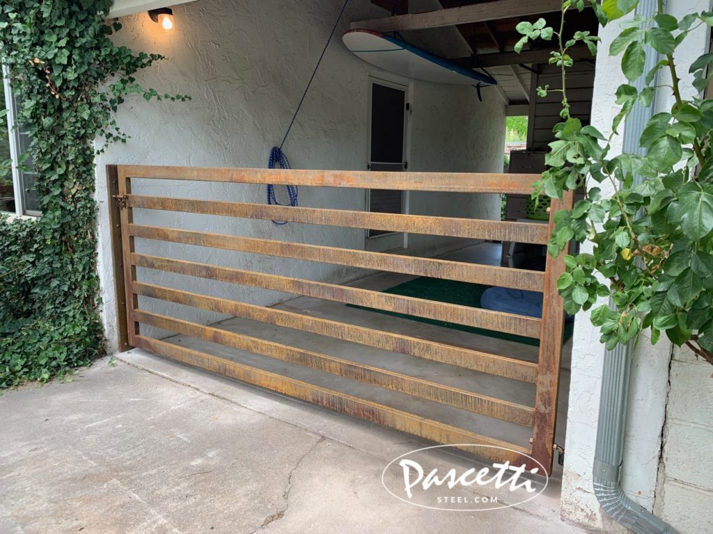 custom steel security gate with a sliding latch lock